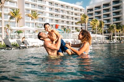 Family swimming in Pool