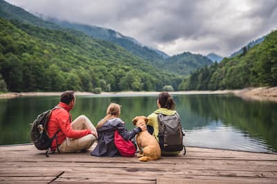 Family with pet outdoors